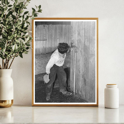 Mexican Boy Drinks from Faucet in Robstown Texas 1939