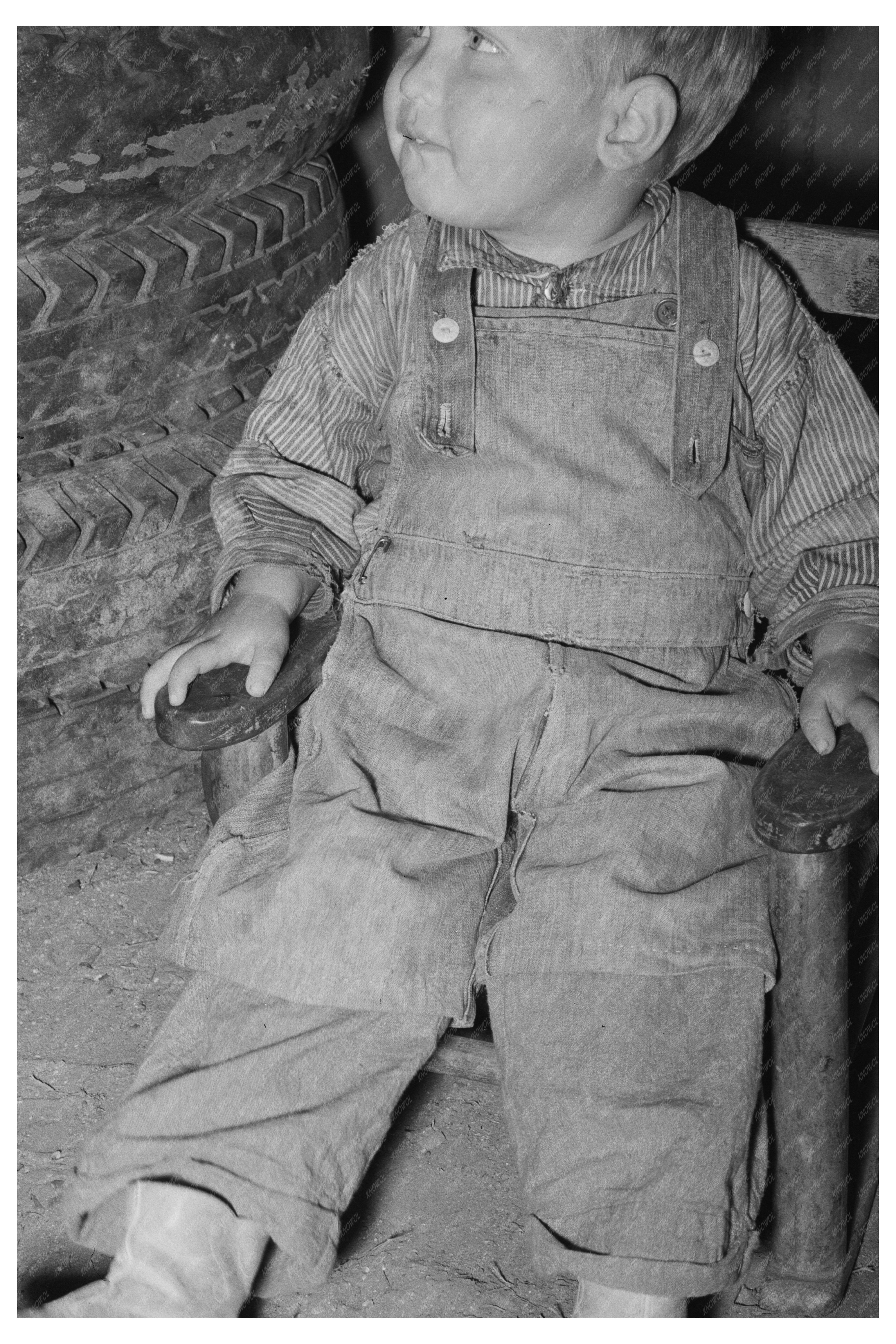 Child in Tent Home with Tires Nueces Bay Texas 1939