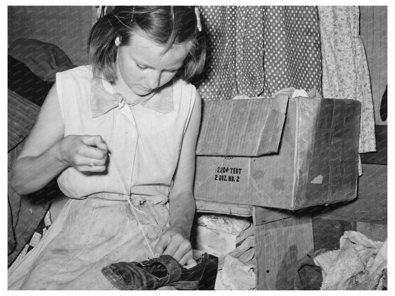 Migrant Girl Repairing Shoes in Sebastian Texas 1939