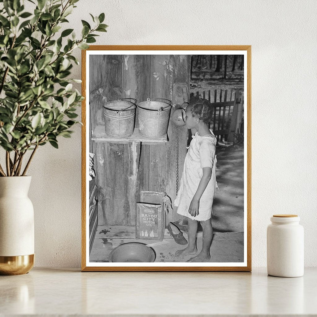 Daughter of Sharecropper Drinking from Gourd 1939