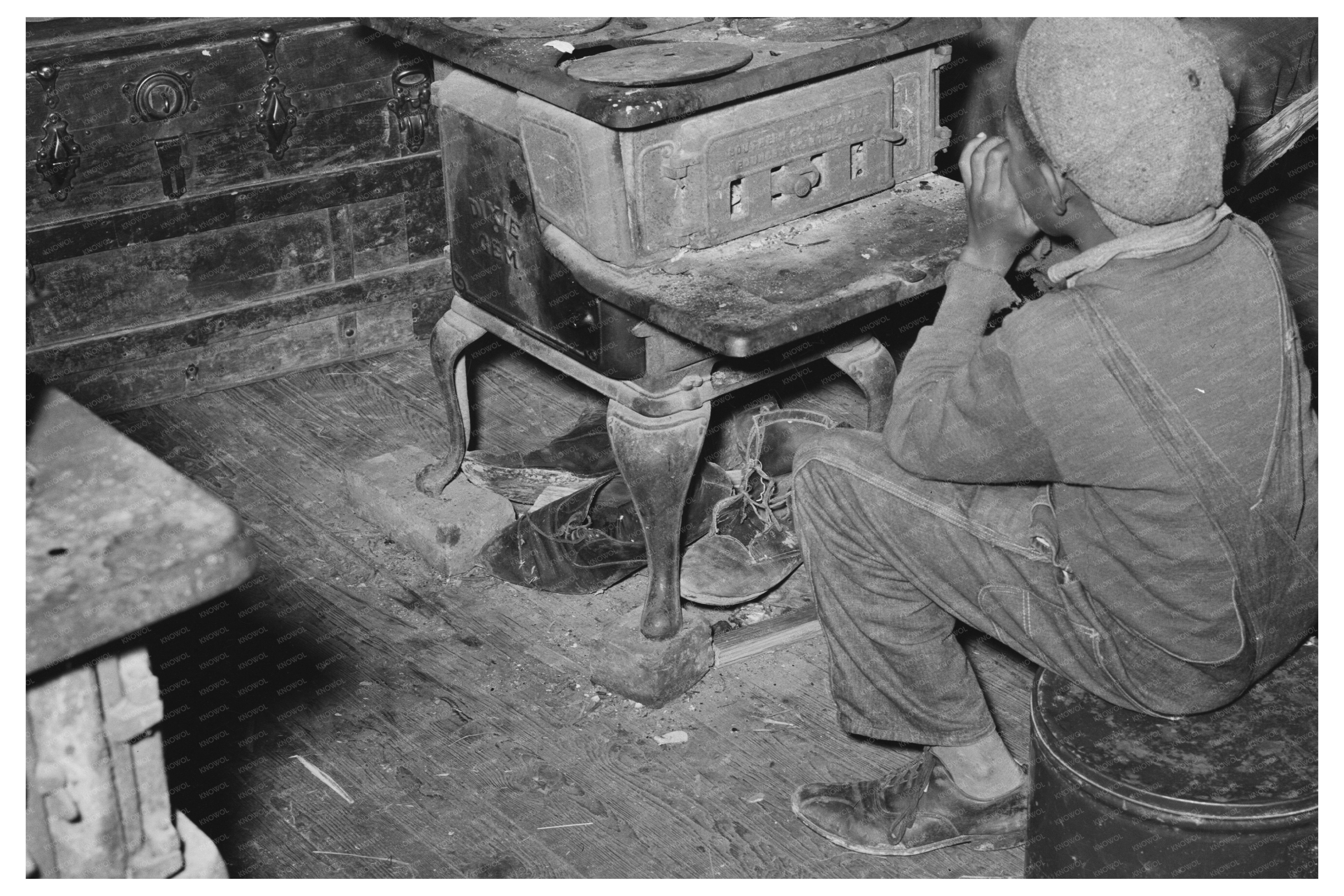 Young Boy by Stove in Strawberry Picking Season 1939