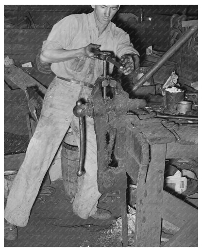 Blacksmith Threading Pipe in San Augustine Texas 1939