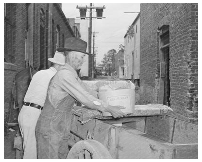 Farmer Loading Wagon in San Augustine Texas April 1939