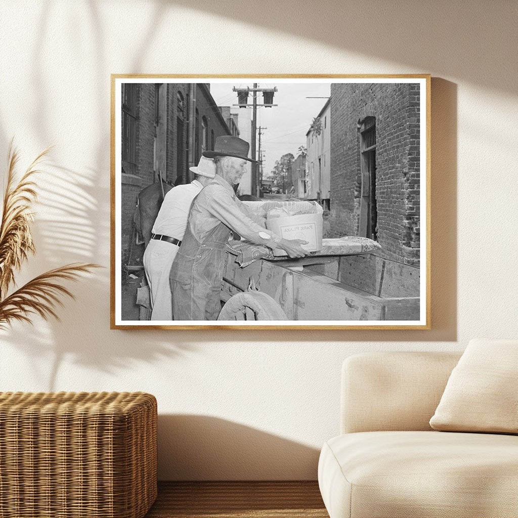 Farmer Loading Wagon in San Augustine Texas April 1939