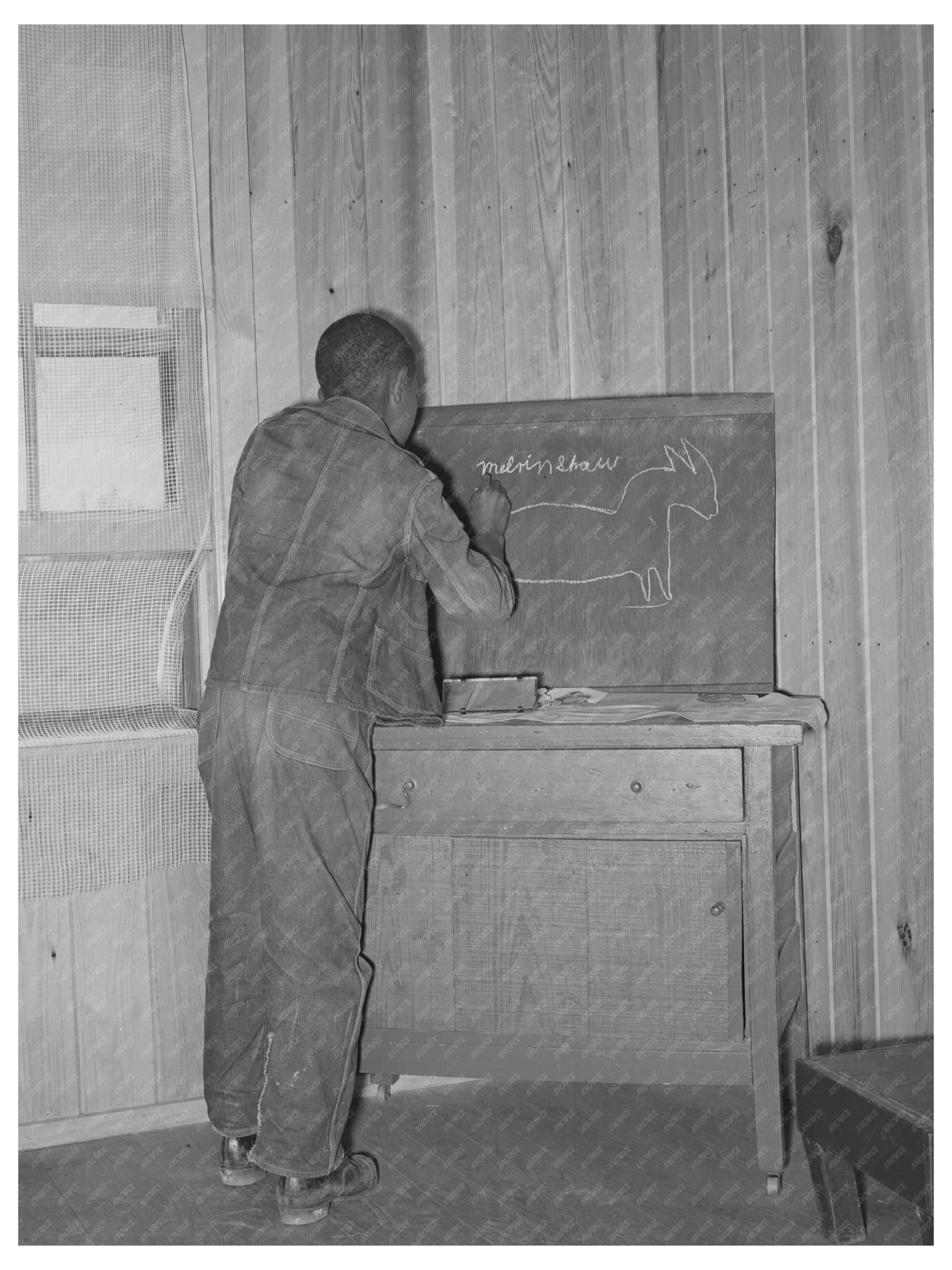 Young Boy Drawing on Blackboard at Sabine Farms 1939