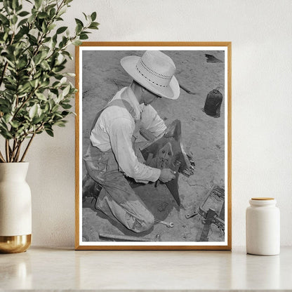 Laborer Adjusting Plow Point on Tractor Texas 1939