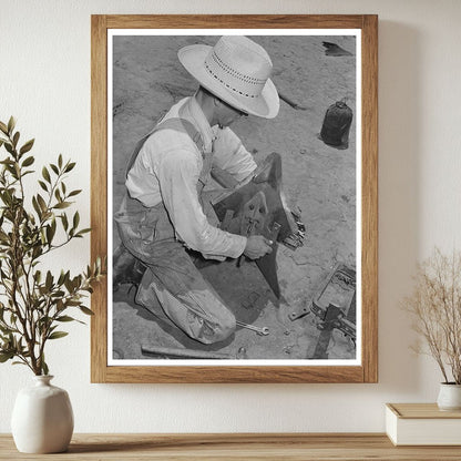 Laborer Adjusting Plow Point on Tractor Texas 1939