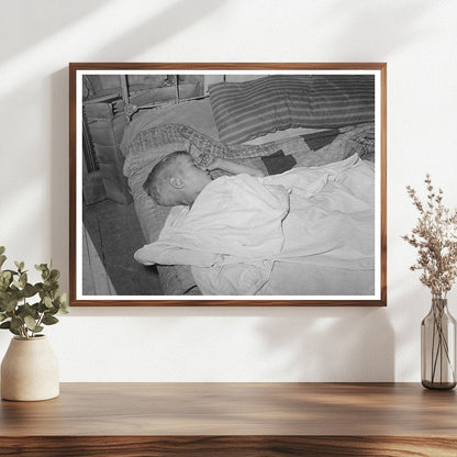 Boy Asleep in Arkansas River Bottom June 1939