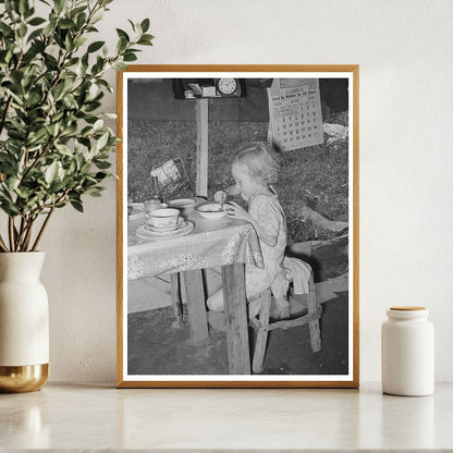 Daughter of Day Laborer Lunching in Tent Home 1939