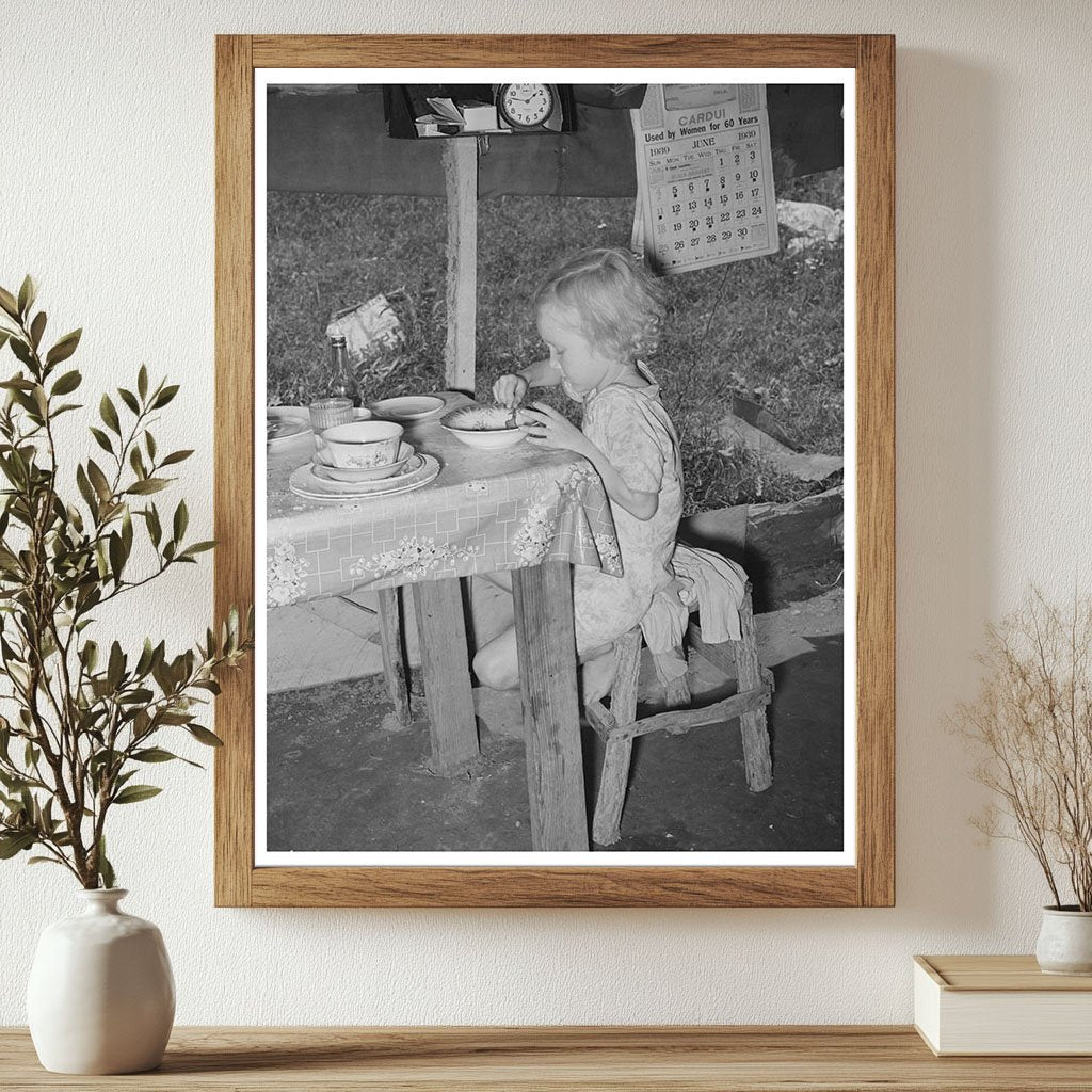 Daughter of Day Laborer Lunching in Tent Home 1939