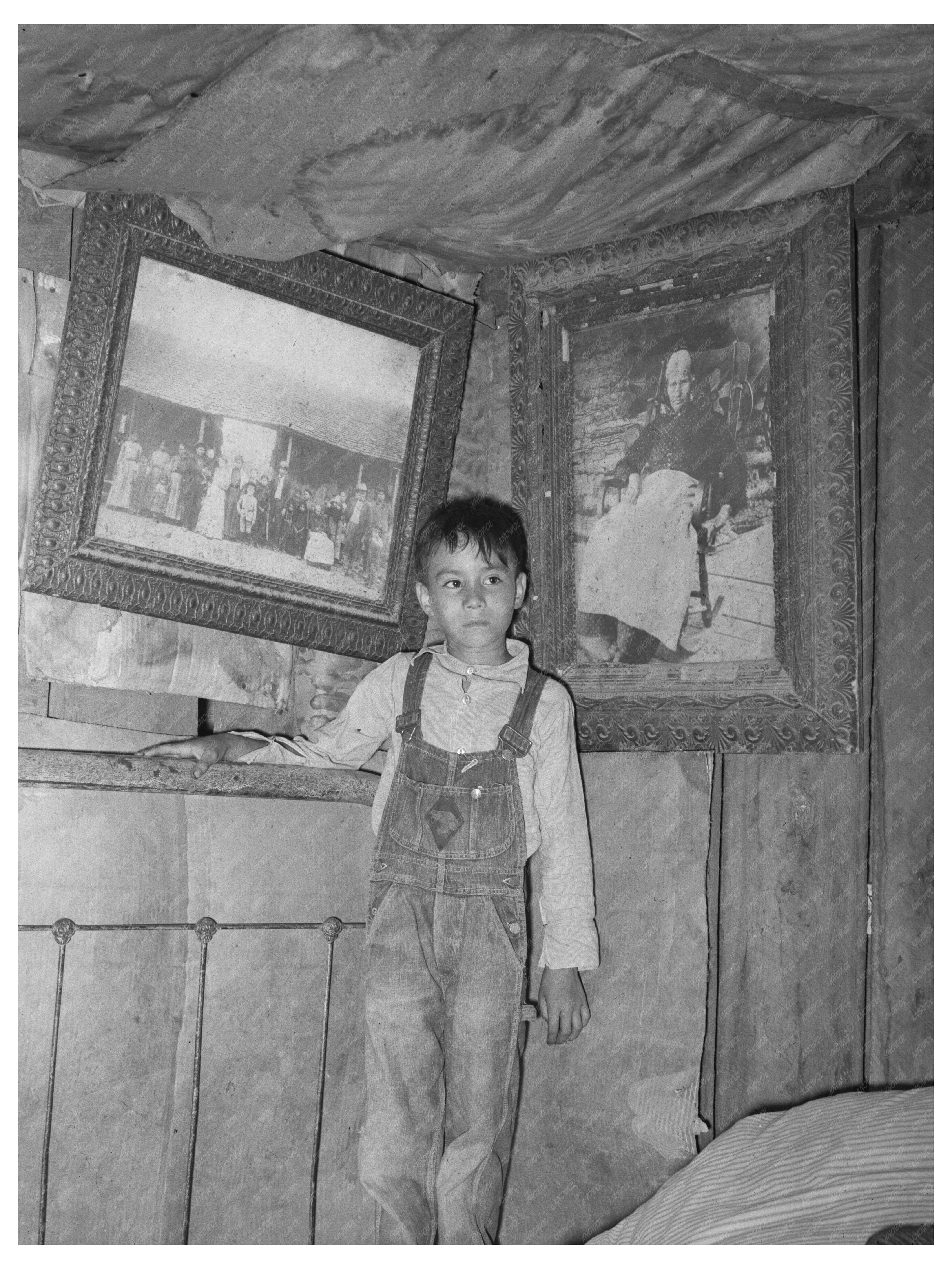 Indian Boy with Ancestor Portraits Sallisaw Oklahoma 1939