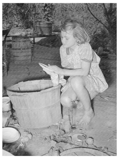 Girl Packing Dishes for California Migration July 1939