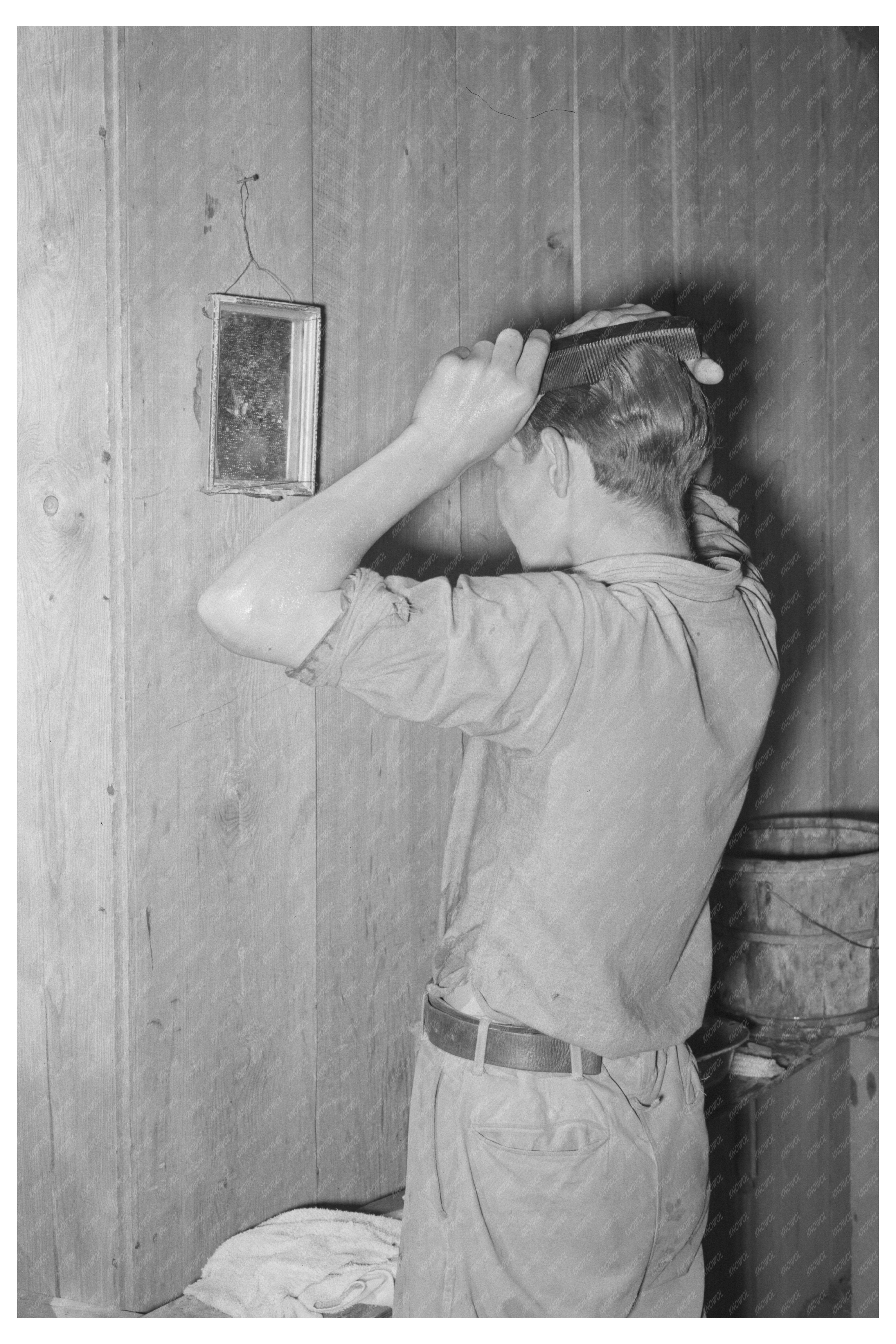 Migrant Boy Combing Hair at Home Muskogee Oklahoma 1939