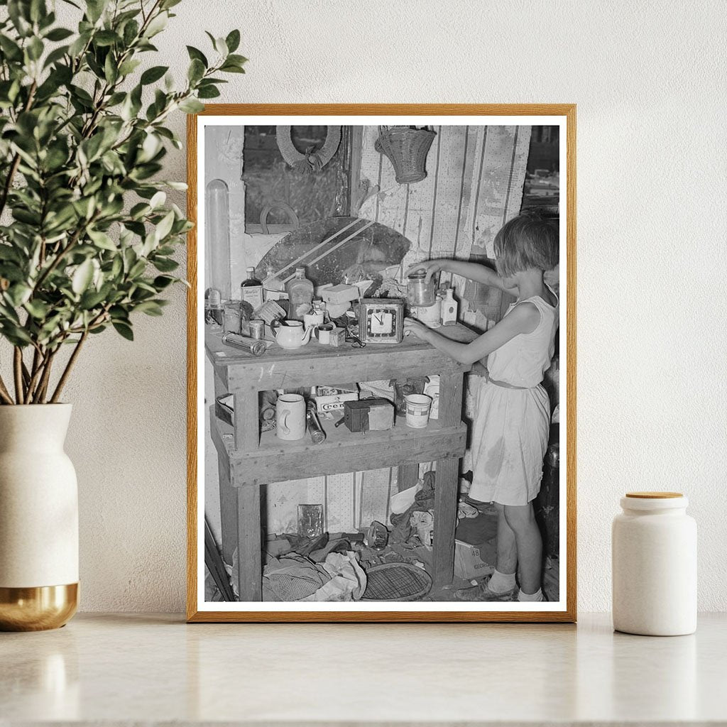 Child at Cluttered Table in Mays Avenue Camp 1939