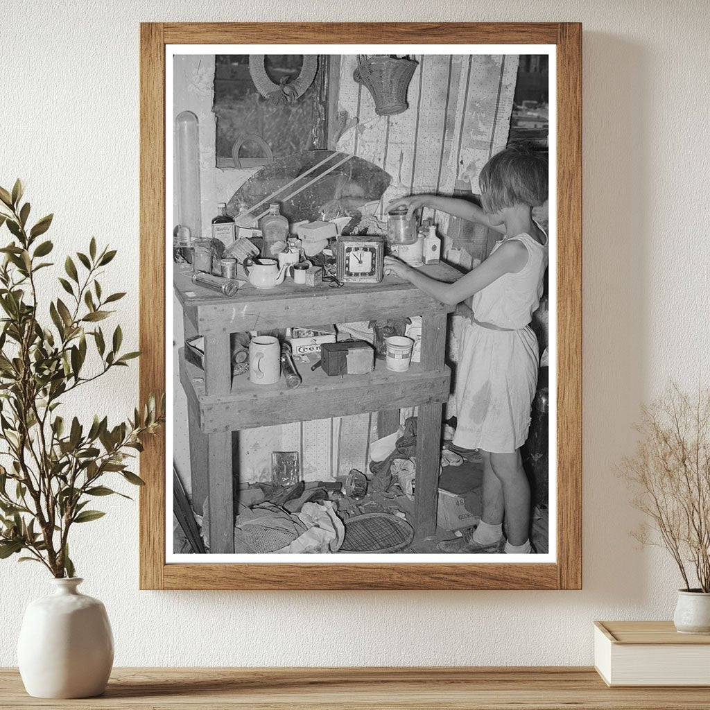 Child at Cluttered Table in Mays Avenue Camp 1939