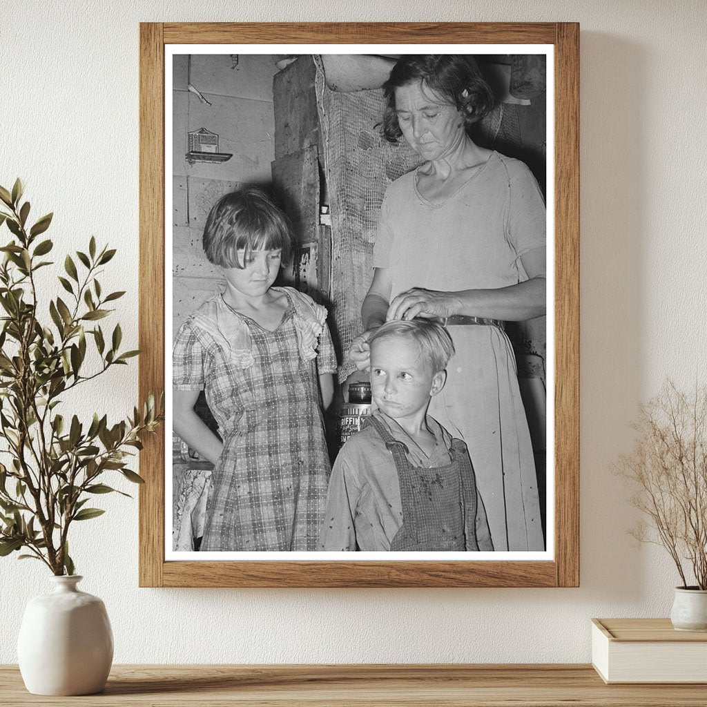 Mother Adjusts Sons Hair in Oklahoma City Camp 1939