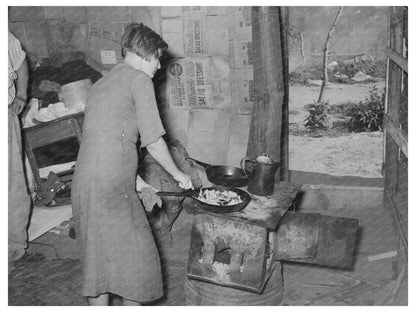 Woman Prepares Breakfast in Mays Avenue Camp 1939