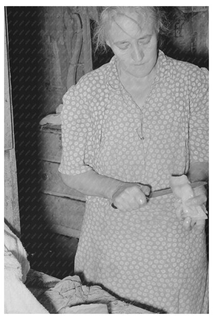 Woman Slicing Fatback for Meal in Oklahoma July 1939