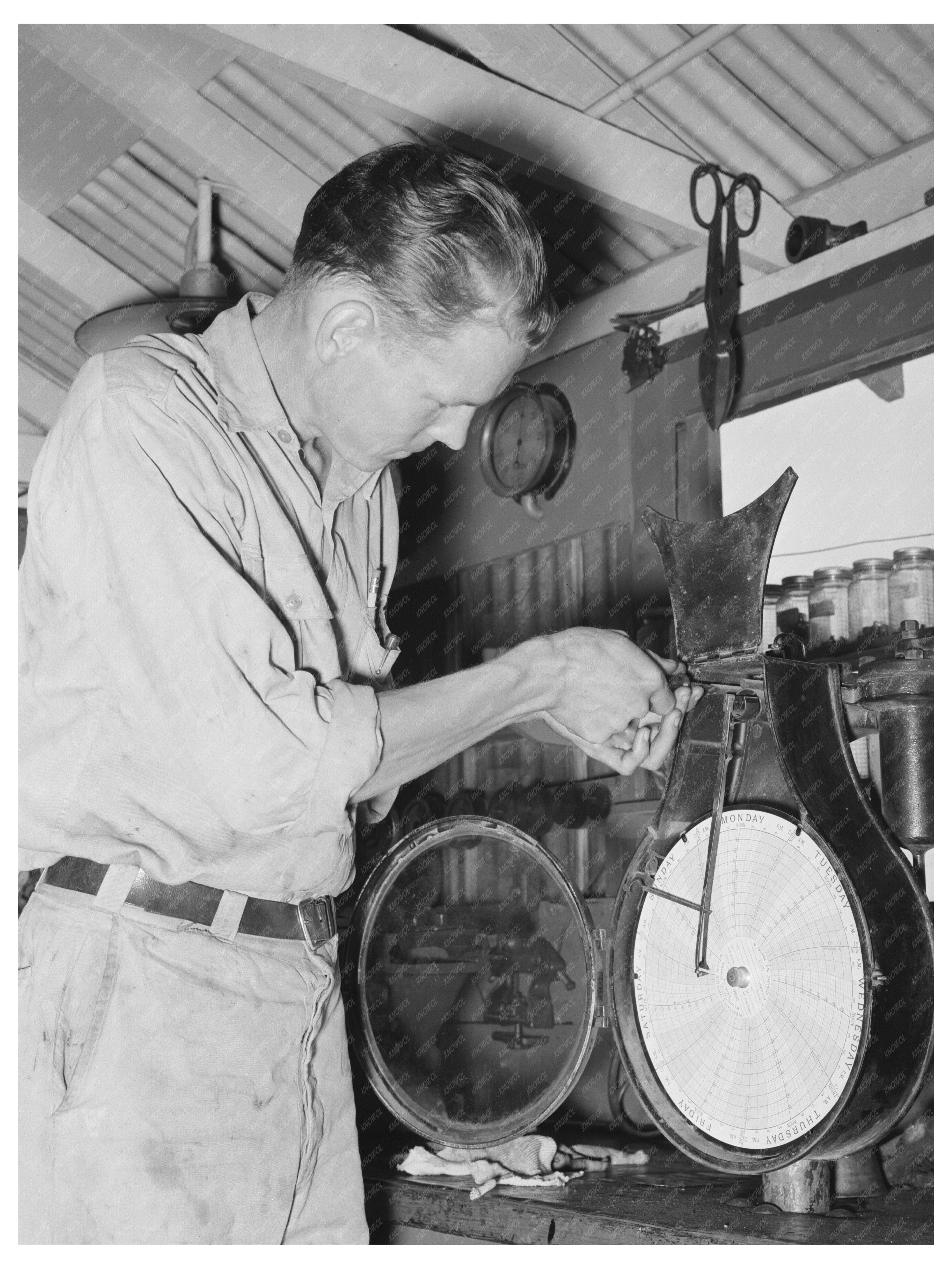 Man Repairs Recording Thermometer at Oklahoma Oil Refinery 1939
