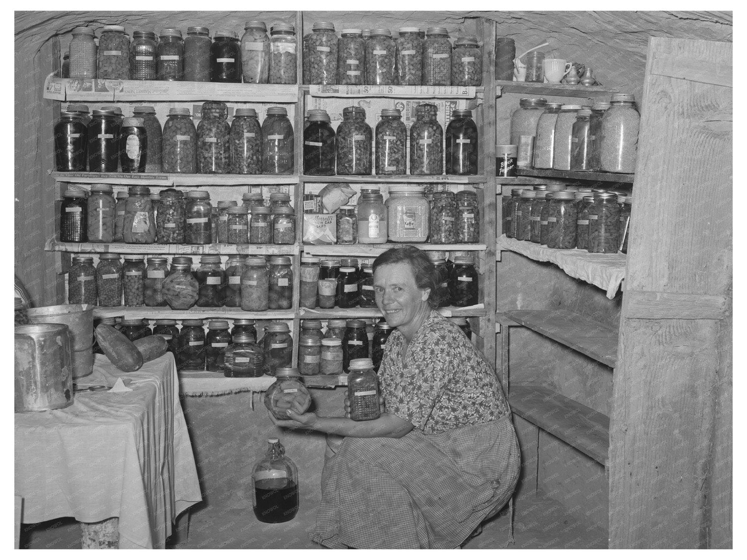 Mrs. Schoenfeldt in Kansas Fruit Cellar August 1939