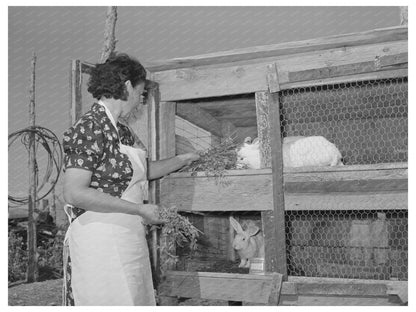 Ofelia Trujillo Feeding Rabbits in Taos New Mexico 1939