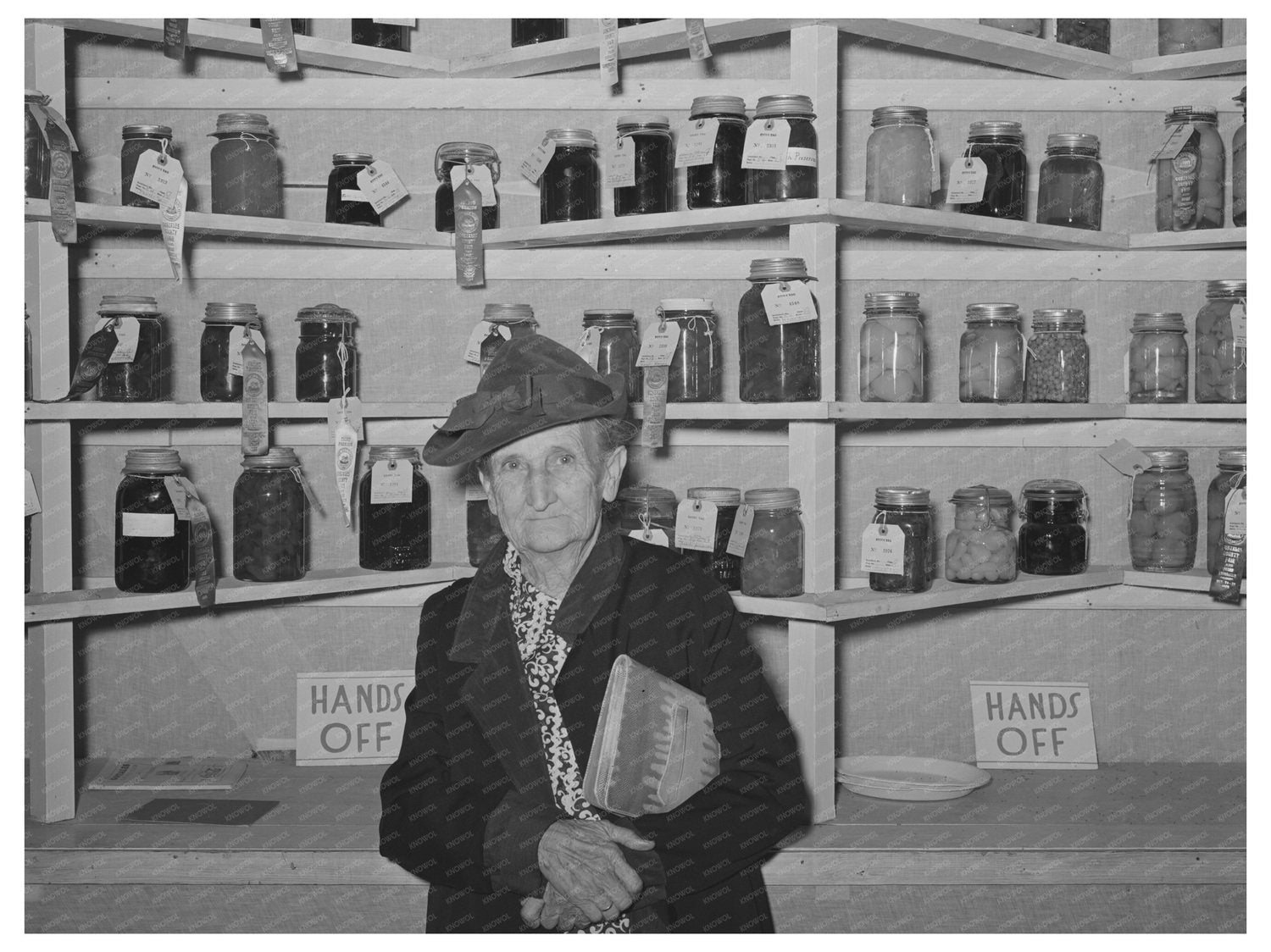 Elderly Woman with Handwork and Canned Goods 1939