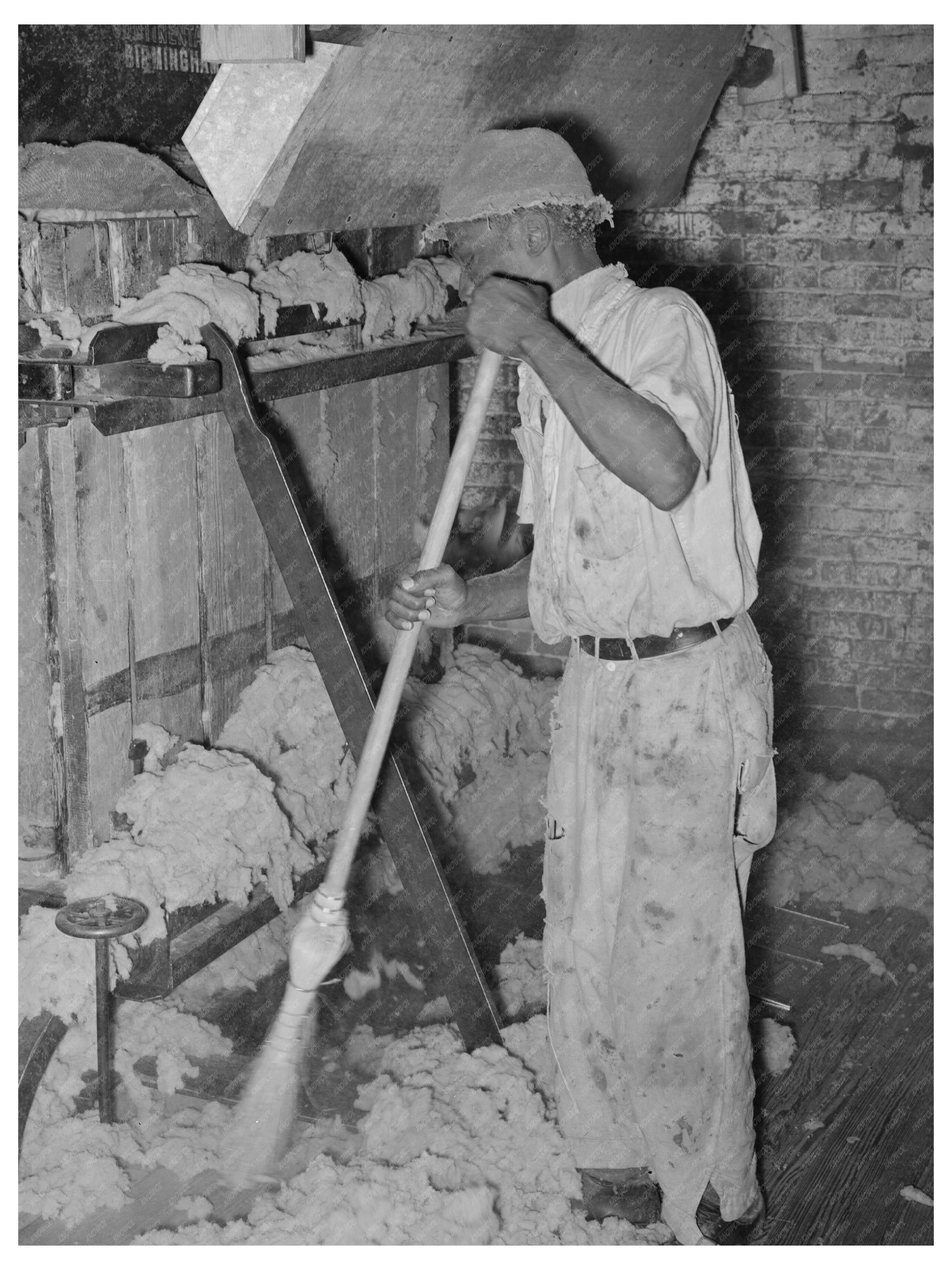 Worker Operating Baling Machine in Texas 1939