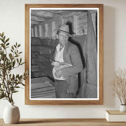 Man Holding Chicken at Brownwood Poultry House 1939