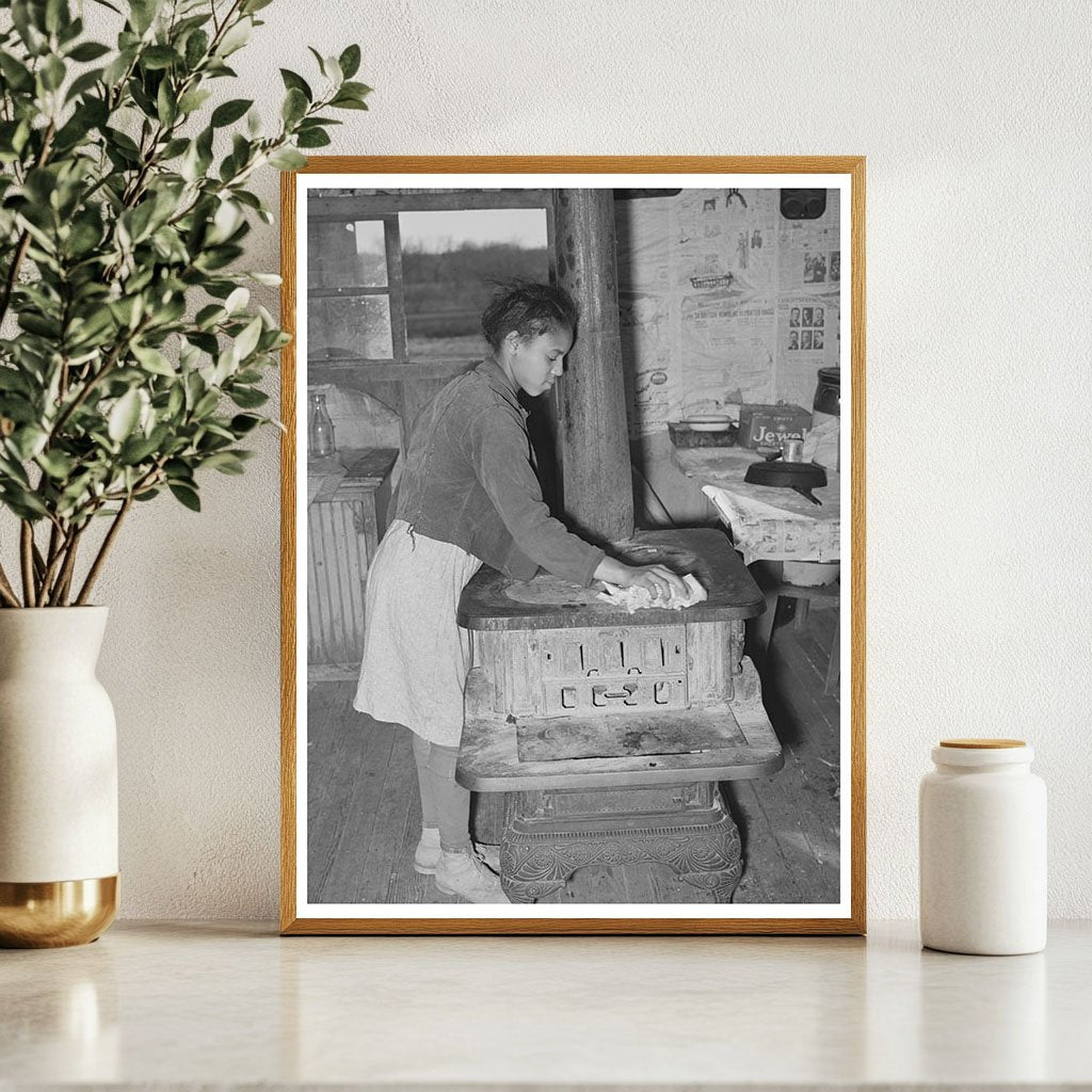 Daughter of Tenant Farmer Cleaning Stove Oklahoma 1940