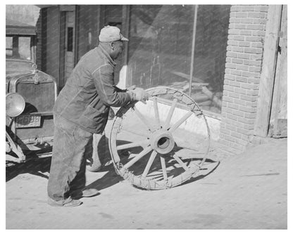 1940 Farmer Repairing Wagon Wheel in Depew Oklahoma