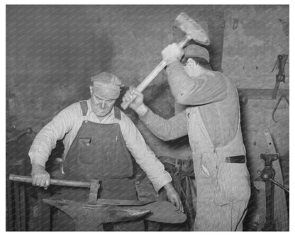 Blacksmith and Helper Working on Plow Point Depew 1940