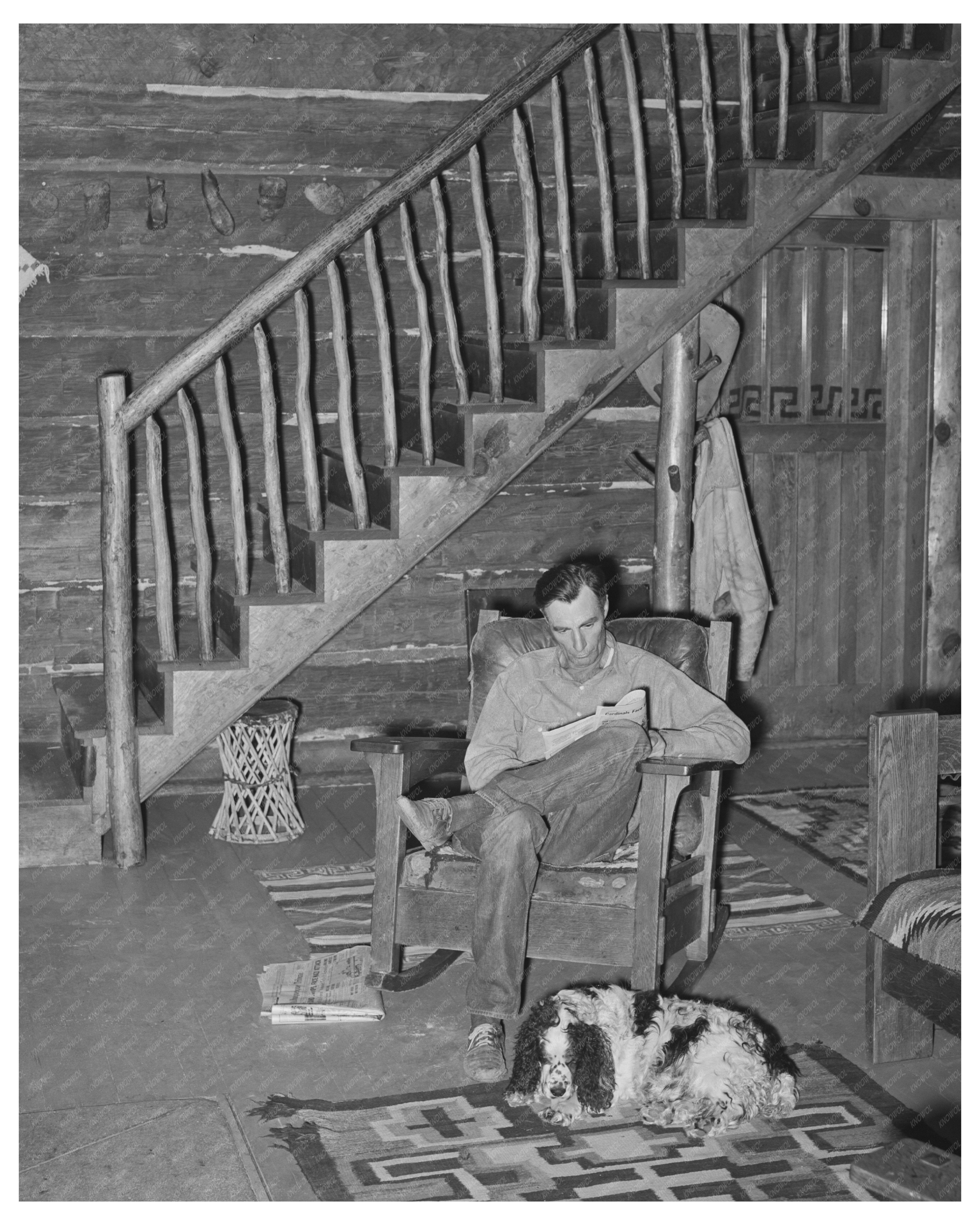 Navajo Lodge Manager and Dog by Fireplace April 1940