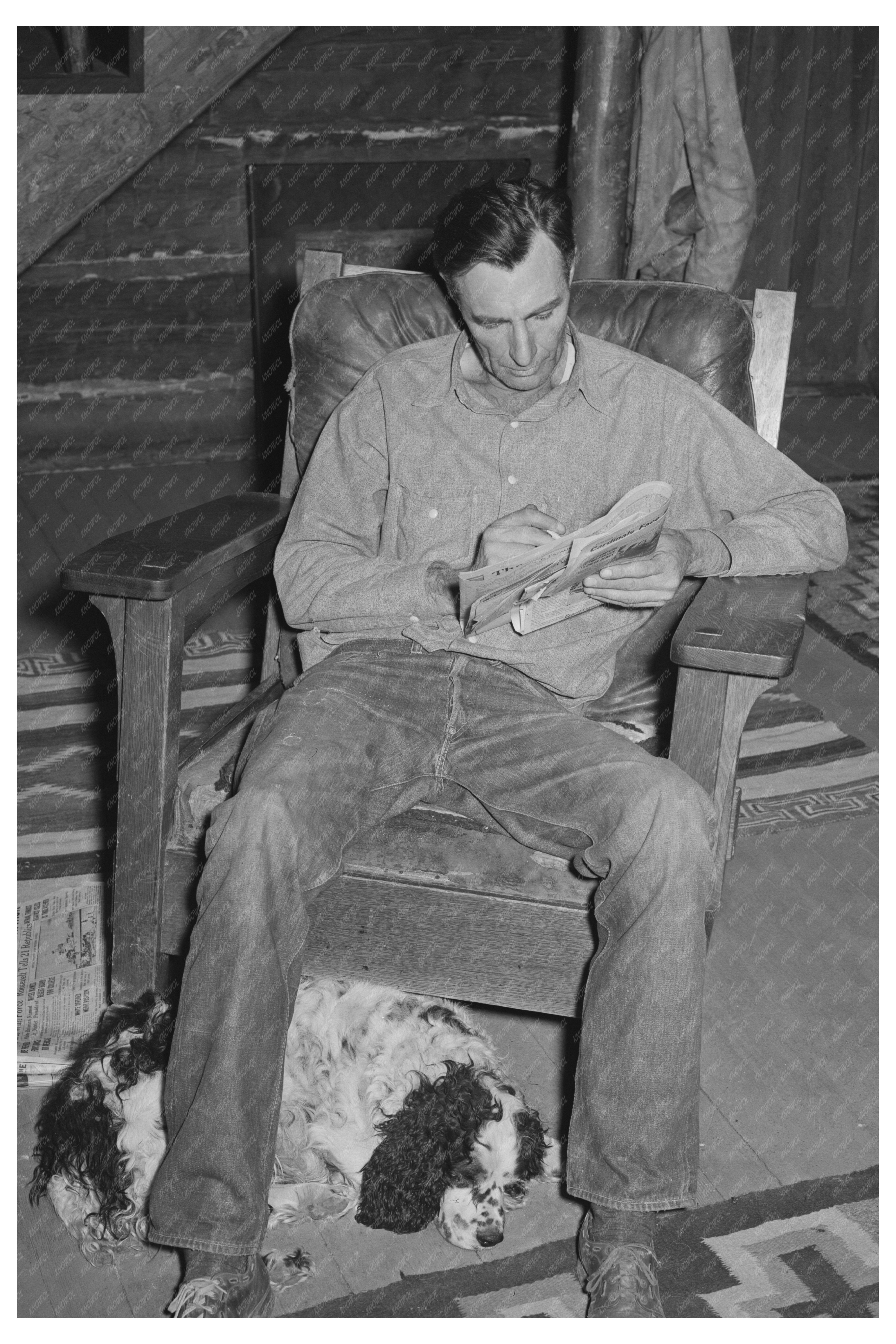 Navajo Lodge Manager and Dog Relaxing with Crossword Puzzle 1940