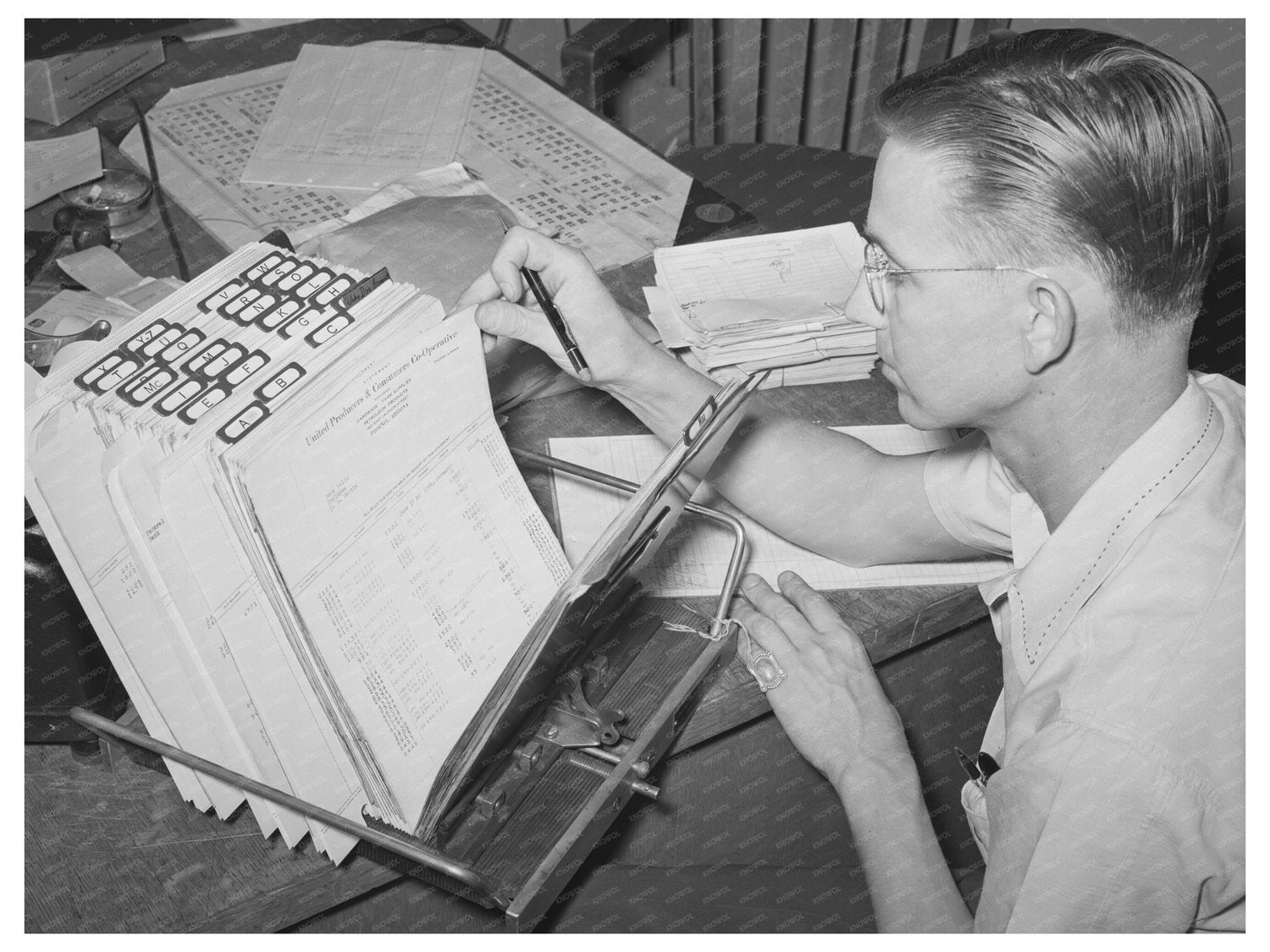 1940 Officer Reviewing Cooperative Books in Phoenix Arizona