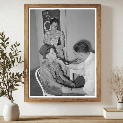 Doctor Examines Child at Agua Fria Camp May 1940