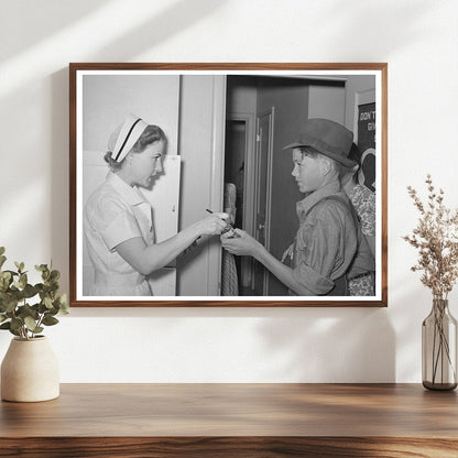 Nurse Instructs Migratory Laborers Son on Medication 1940