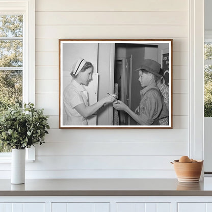 Nurse Instructs Migratory Laborers Son on Medication 1940