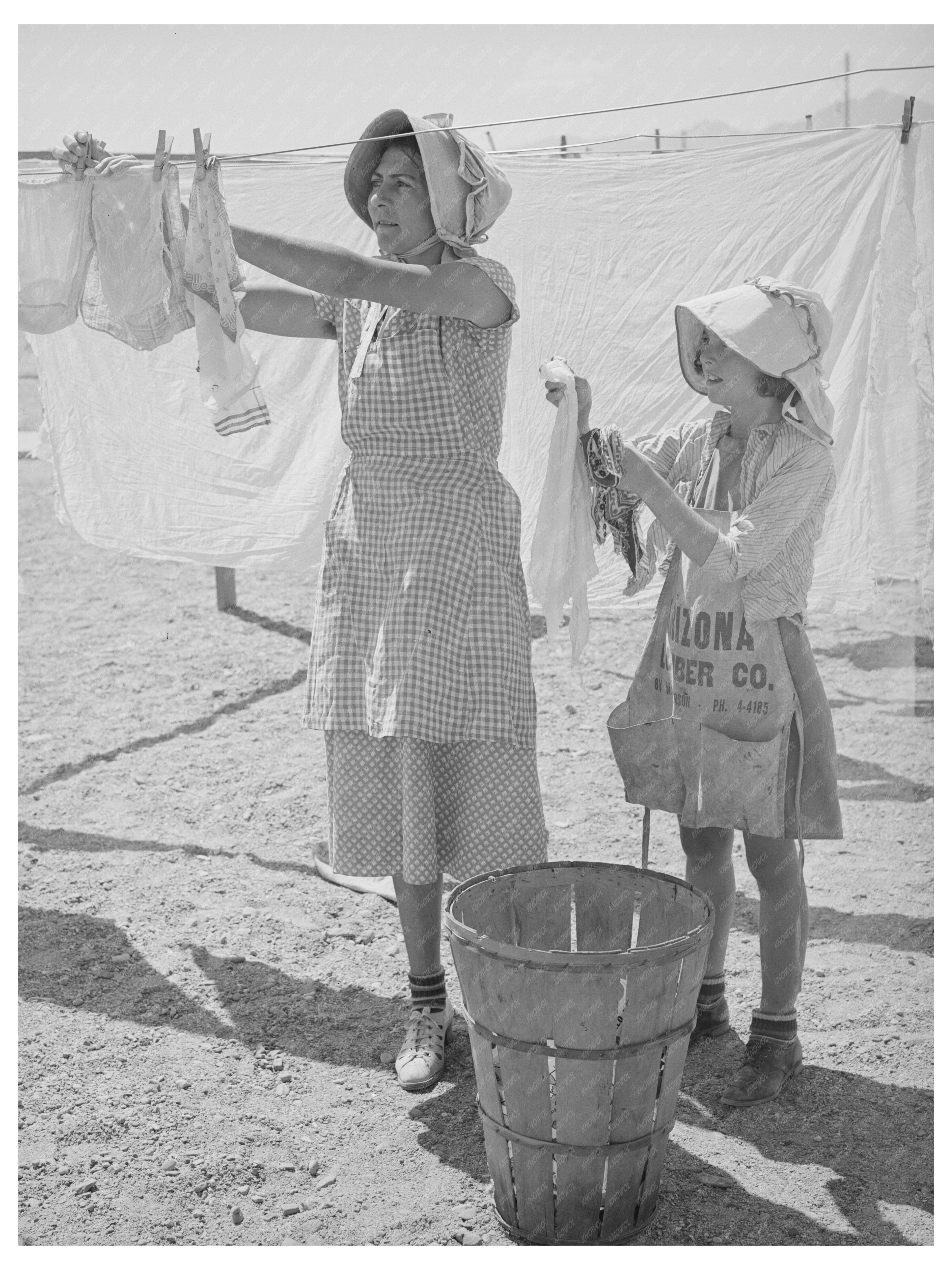 Wife and Daughter Hanging Laundry in Arizona 1940