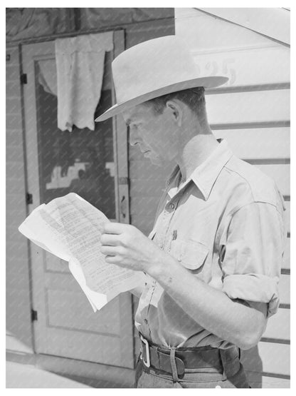 Migratory Worker Reads Truck License Instructions 1940