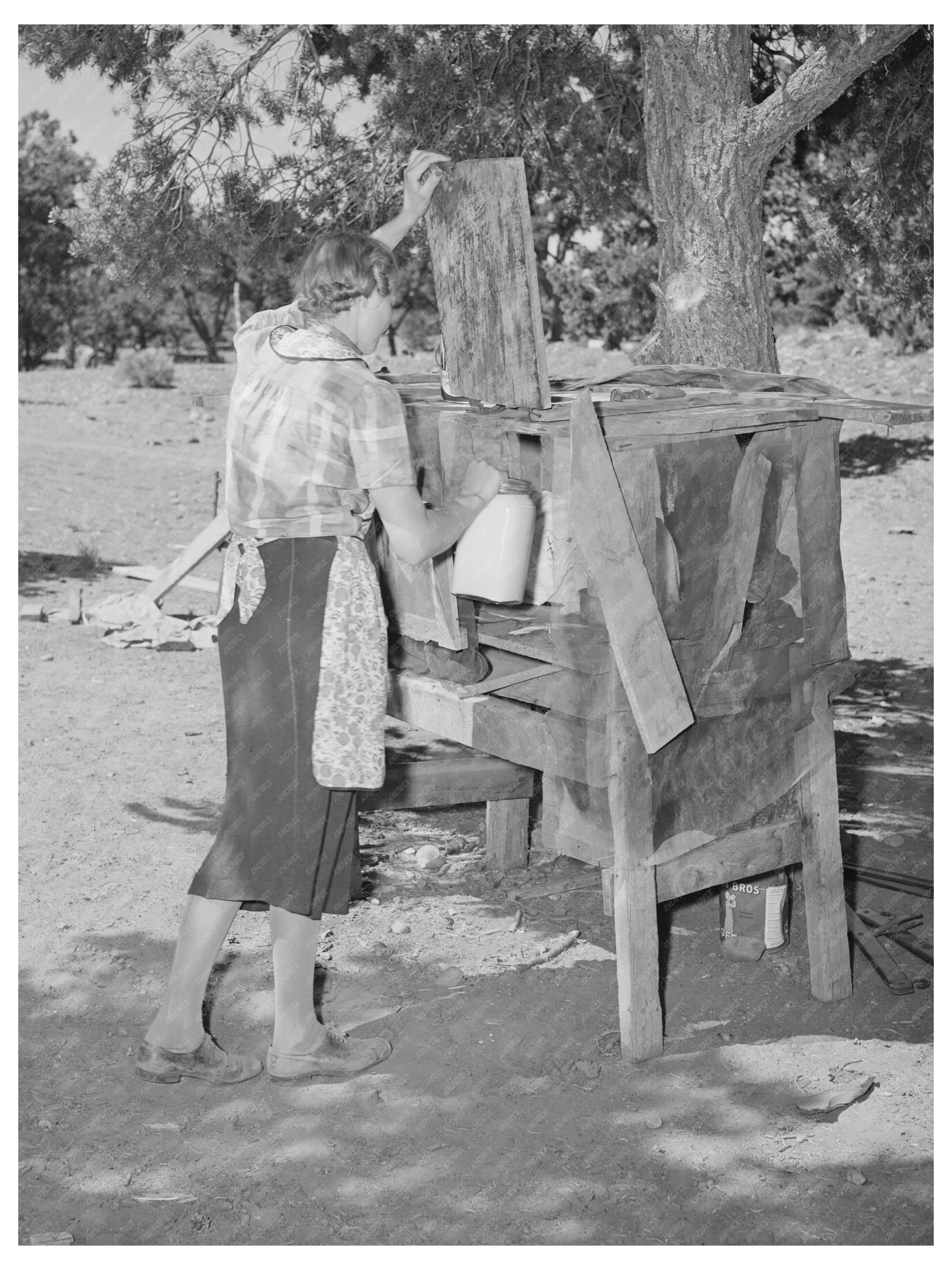 Mrs. Faro Caudill Storing Milk in Pie Town New Mexico 1940