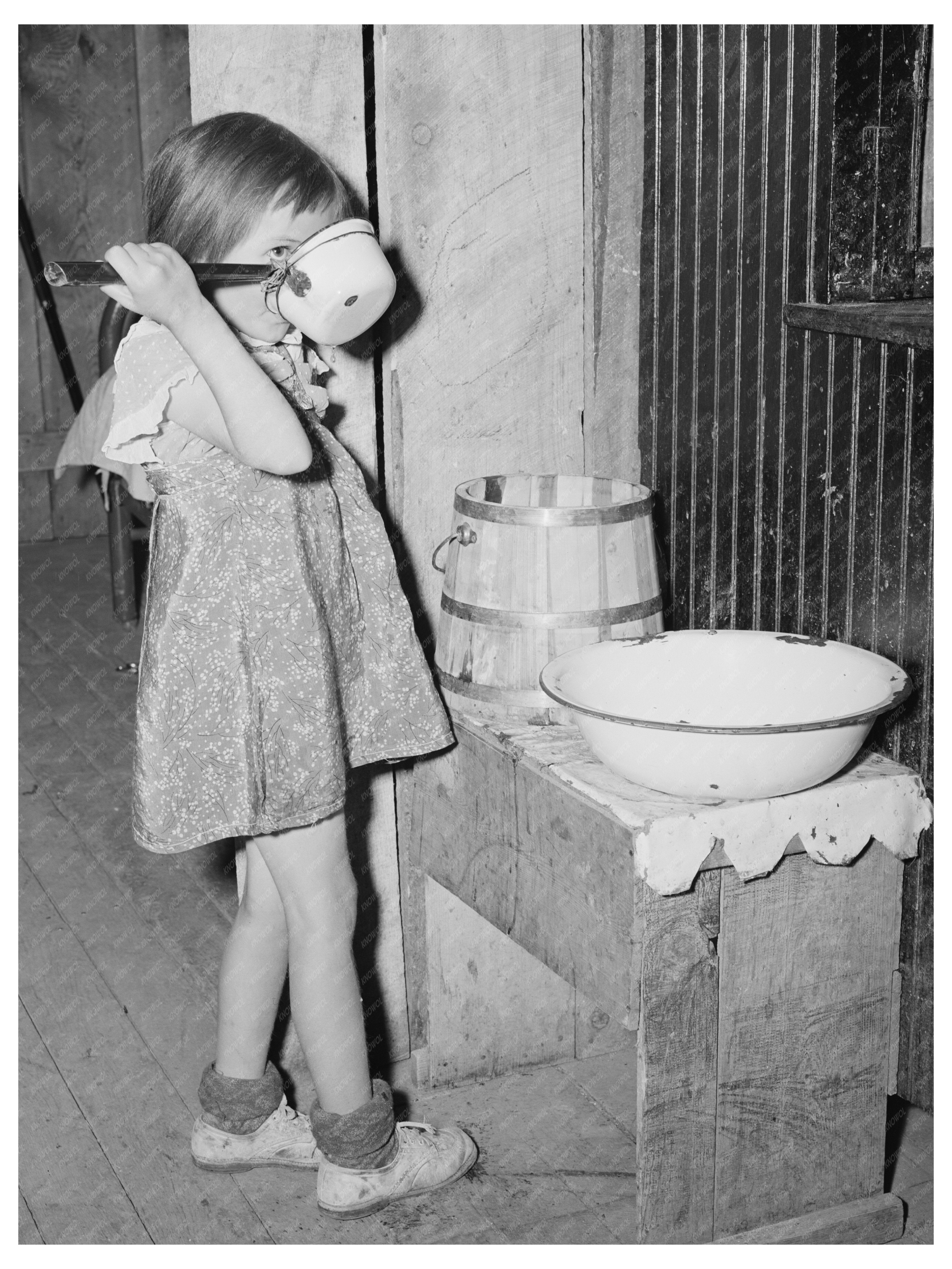 Josie Drinking Water in Pie Town New Mexico May 1940