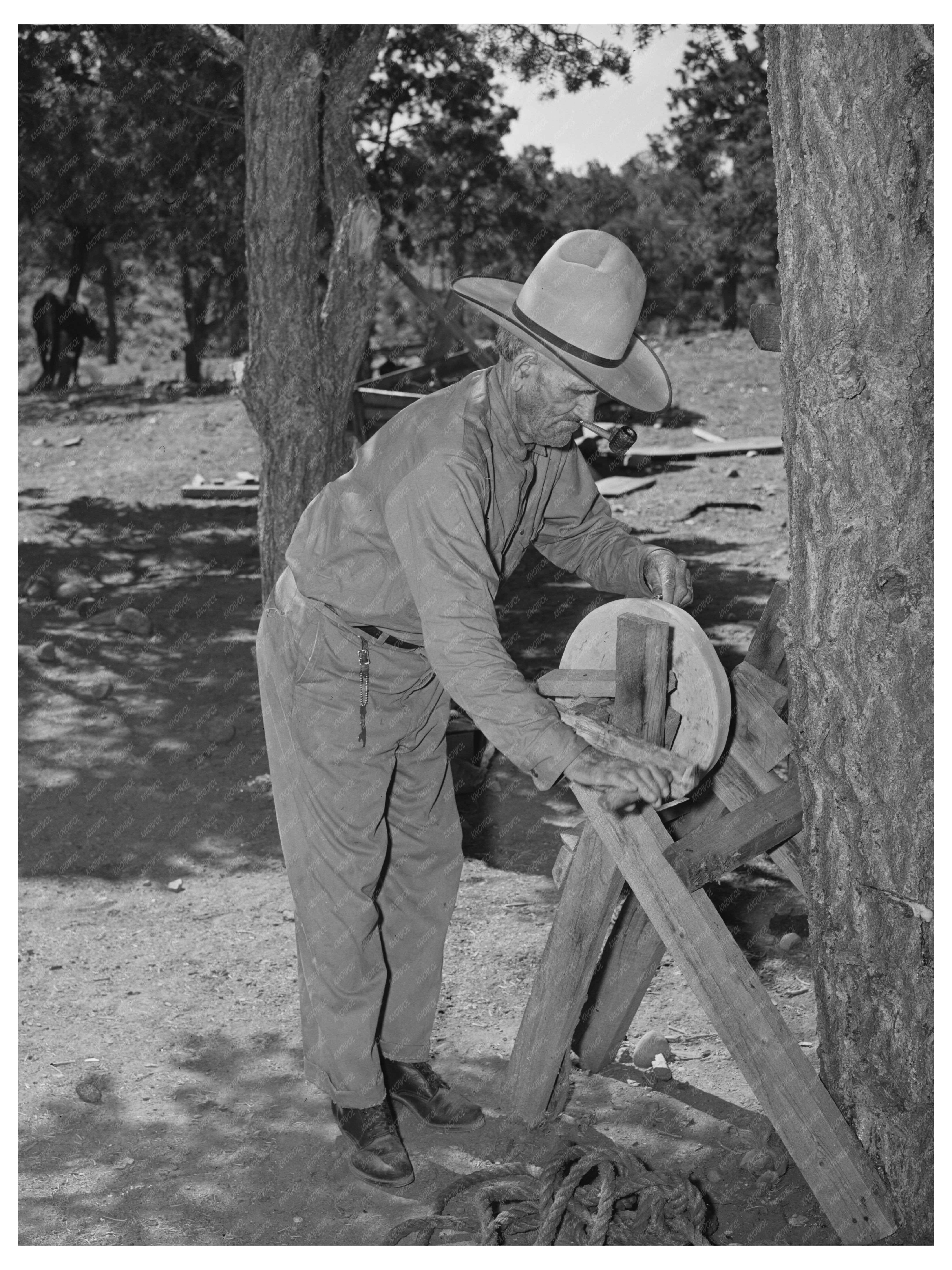 Father Sharpening Knife in Pie Town New Mexico 1940