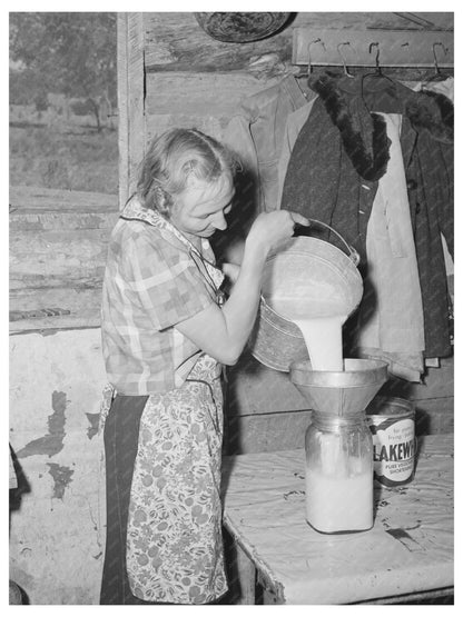 Mrs. Faro Caudill Straining Milk in Pie Town 1940