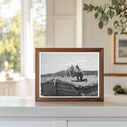 Faro Caudill Dismantles Chimney in Pie Town New Mexico 1940