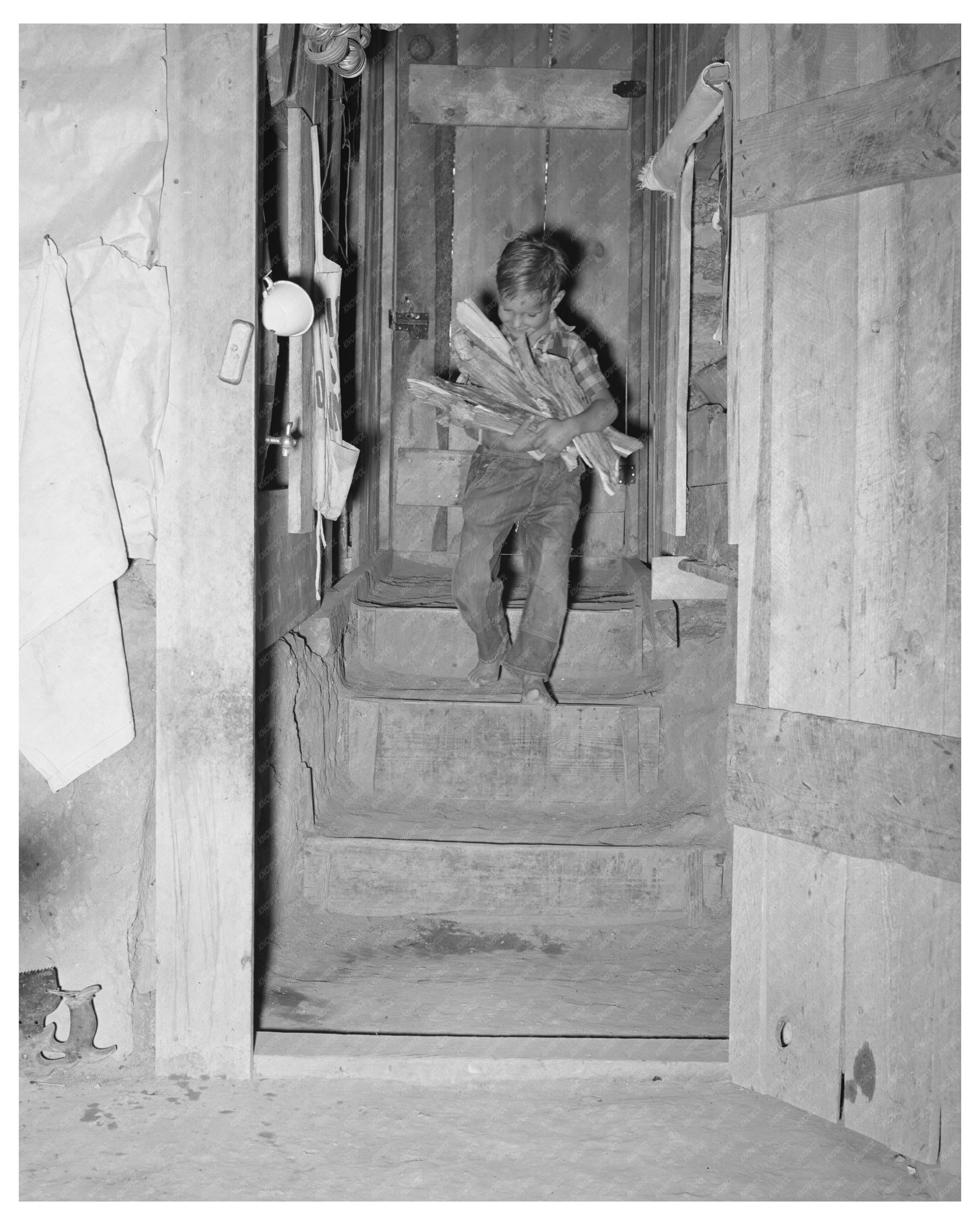 1940 Boy Carrying Wood into Dugout in Pie Town New Mexico