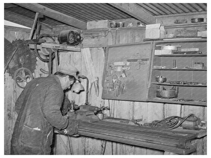 George Hutton Jr. in Farm Machine Shop Pie Town 1940