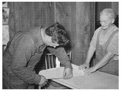 Mrs. George Hutton and Son Measuring Paper in Pie Town 1940