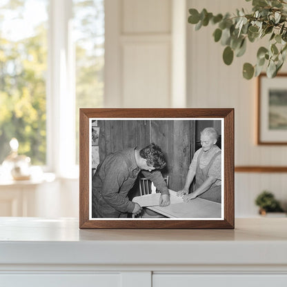 Mrs. George Hutton and Son Measuring Paper in Pie Town 1940