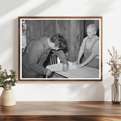 Mrs. George Hutton and Son Measuring Paper in Pie Town 1940