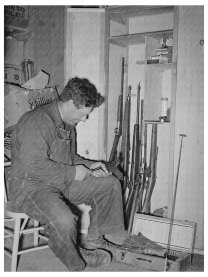 George Hutton Jr. Examining Firearms Pie Town 1940